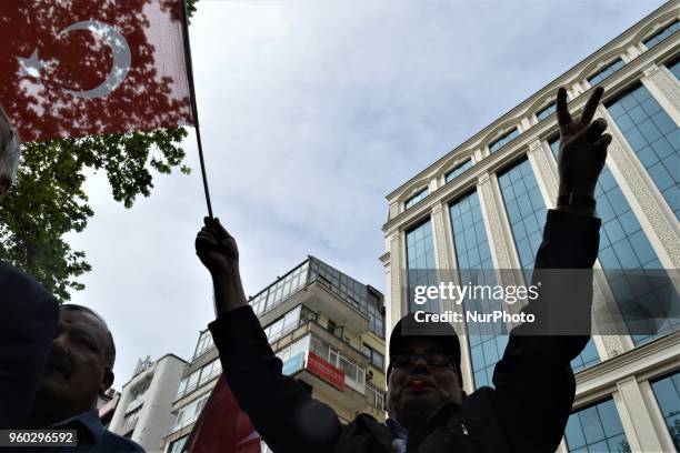 Man waving a Turkish flag flashes a victory sign during a demonstration staged by the main opposition Republican People's Party , protesting the...