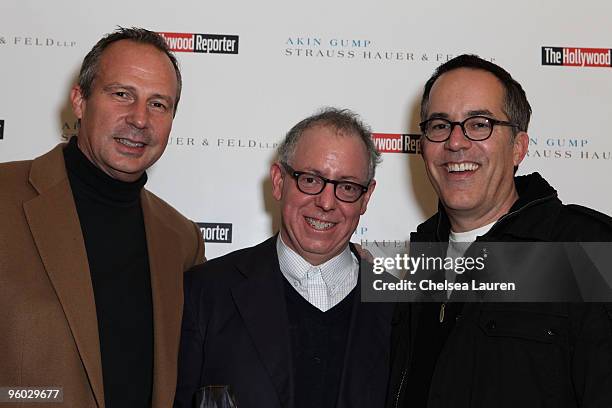 The Hollywood Reporter publisher Eric Mika, Focus Features CEO/Indie Icon Award recipient James Schamus and Sundance Film Festival Director John...