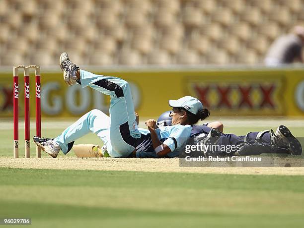 Lisa Sthalekar of the Breakers collides with Elyse Villani of the Spirit during the women's Twenty20 Big Bash match between the Victorian Spirit and...