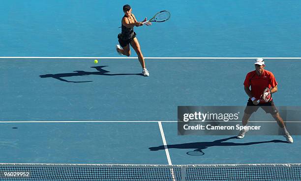 Anastasia Rodionova of Australia plays a forehand in her first round mixed doubles match with Paul Hanley of Australia against Alisa Kleybanova of...