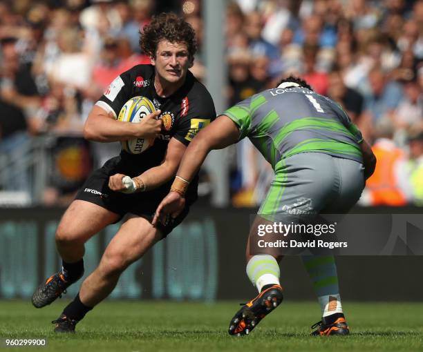 Alec Hepburn of Exeter takes on Sam Lockwood during the Aviva Premiership Semi Final between Exeter Chiefs and Newcastle Falcons at Sandy Park on May...