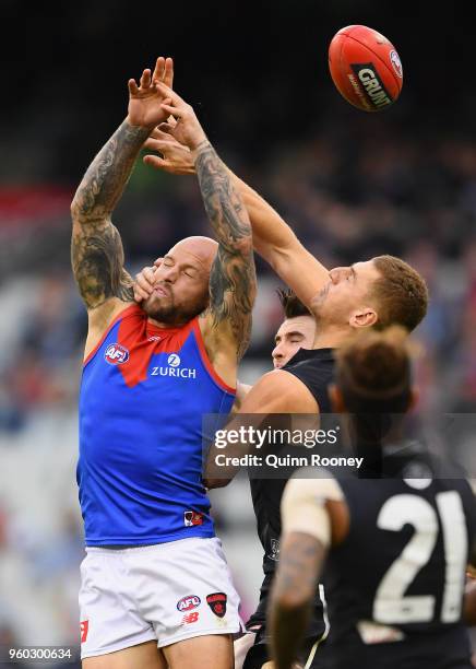 Nathan Jones of the Demons and Liam Jones of the Blues compete for a mark during the round nine AFL match between the Carlton Blues and the Melbourne...