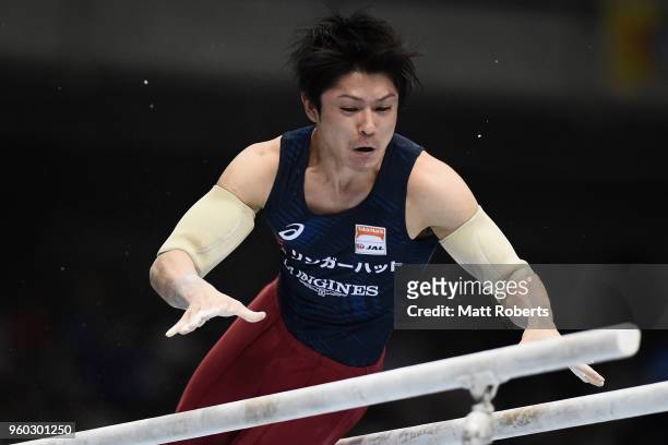 Kohei Uchimura of Japan competes on the parallel bars during day two of the 57th Artistic Gymnastics NHK Trophy at the Tokyo Metropolitan Gymnasium...