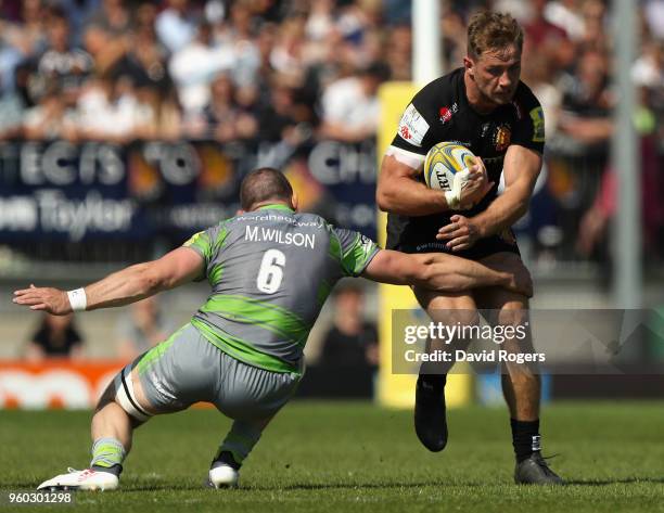 Sam Hill of Exeter Chiefs is tackled by Mark Wilson during the Aviva Premiership Semi Final between Exeter Chiefs and Newcastle Falcons at Sandy Park...