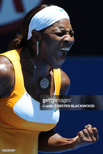 Tennis player Serena Williams shouts during her third round women's singles match against Spanish opponent Carla Suarez Navarro at the Australian...