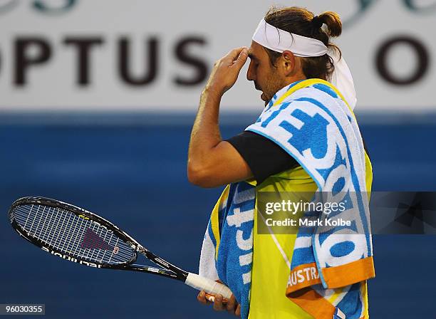 Marcos Baghdatis of Cyprus looks on between points in his third round match against Lleyton Hewitt of Australia during day six of the 2010 Australian...