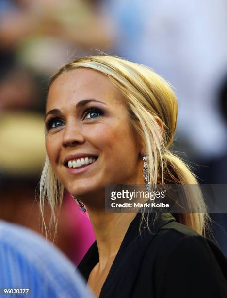 Television personality Bec Hewitt watches the third round match between her husband Lleyton Hewitt of Australia and Marcos Baghdatis of Cyprus during...