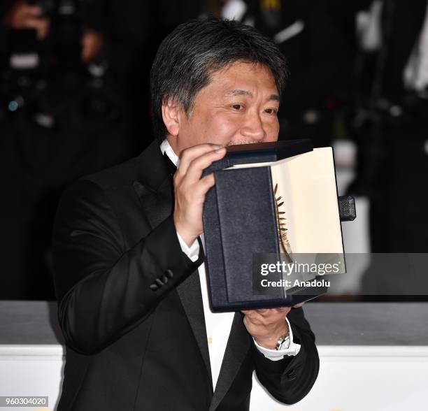 Japanese director Hirokazu Kore-eda poses during the Award Winners photocall after winning the Palme d'Or award for 'Shoplifters' at the 71st Cannes...