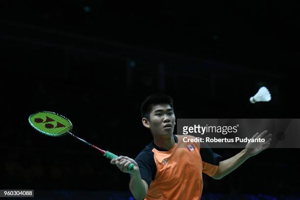 Jason Anthony Ho Sue of Canada competes against Anthony Sinisuka Ginting of Indonesia during qualification match on day one of the BWF Thomas & Uber...