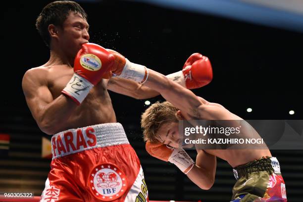 Japan's Hiroto Kyoguchi and Philippines' Vince Paras fight during thier IBF world minimumweight title boxing bout in Tokyo on May 20, 2018.