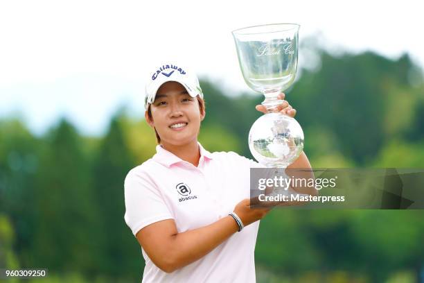 Hee-Kyung Bae of South Korea poses with the trophy after winning the Chukyo TV Bridgestone Ladies Open at Chukyo Golf Club Ishino Course on May 20,...