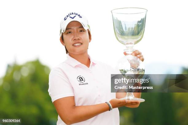 Hee-Kyung Bae of South Korea poses with the trophy after winning the Chukyo TV Bridgestone Ladies Open at Chukyo Golf Club Ishino Course on May 20,...