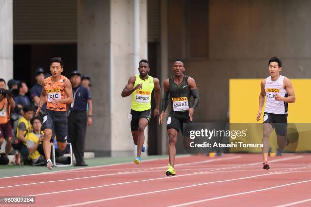 Xie Zhenye of China, Jarrion Lawson of the United States, Isaac Makwala of Botswana, Shota Iizuka of Japan compete in the Men's 200m during the IAAF...