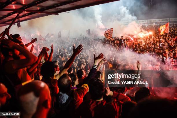 Galatasaray's supporters celebrate their 2017-2018 champion title at Florya Metin Oktay facilities in Istanbul on May 19, 2018 after the Turkish Spor...