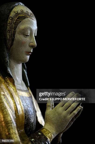 Anne-Sophie LEGGE An ancient Madonna is pictured among other works of art waiting to be restored in Celano, 50km from L'Aquila on January 14, 2010....