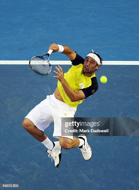 Marcos Baghdatis of Cyprus serves in his third round match against Lleyton Hewitt of Australia during day six of the 2010 Australian Open at...