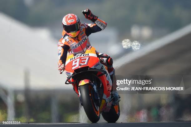 Repsol Honda Team's Spanish rider Marc Marquez waves as he clocked the best time of the warm-up ahead of the French motorcycling Grand Prix on May...