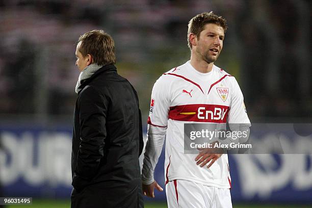 Thomas Hitzlsperger of Stuttgart walks past manager Horst Heldt after the Bundesliga match between SC Freiburg and VfB Stuttgart at the Badenova...