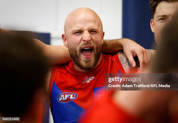 Nathan Jones of the Demons sings the team song during the 2018 AFL round nine match between the Carlton Blues and the Melbourne Demons at the...