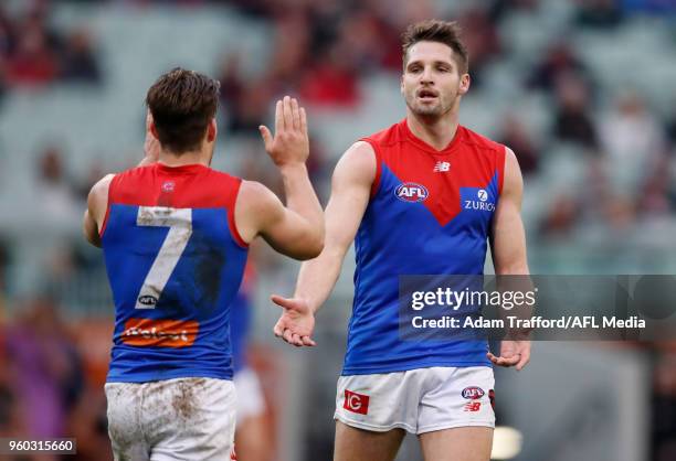 Jesse Hogan of the Demons celebrates a goal with Jack Viney of the Demons during the 2018 AFL round nine match between the Carlton Blues and the...