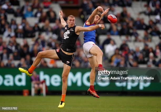 Harry McKay of the Blues and Tim Smith of the Demons compete for the ball during the 2018 AFL round nine match between the Carlton Blues and the...