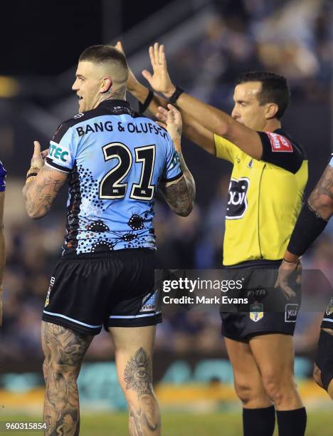 Josh Dugan of the Sharks is sin binned by referee Matt Cecchin during the round 11 NRL match between the Cronulla Sharks and the Canterbury Bulldogs...