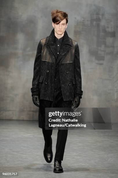 Model walks the runway at the Cerruti fashion show during Paris Menswear Fashion Week Autumn/Winter 2010 on January 22, 2010 in Paris, France.