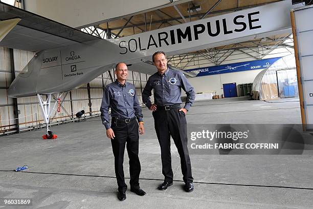 File picture dated June 26, 2009 shows Swiss scientist-adventurer and pilot Bertrand Piccard and Solar Impulse CEO Andre Borschberg posing under the...