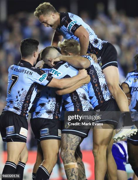 Sharks players celebrate a Jesse Ramien try during the round 11 NRL match between the Cronulla Sharks and the Canterbury Bulldogs at Southern Cross...