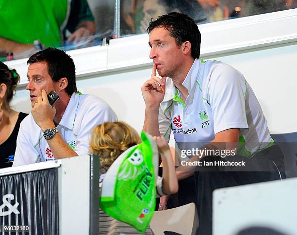 Robbie Fowler of the Fury sits in the grandstand with fellow team mate Terry Cooke during the round 24 A-League match between the North Queensland...