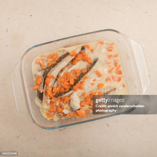 weever fillet in sauce with carrots. - weever fish stock pictures, royalty-free photos & images