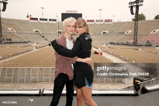 Troye Sivan and Taylor Swift pose onstage during the Taylor Swift reputation Stadium Tour at the Rose Bowl on May 19, 2018 in Pasadena, California