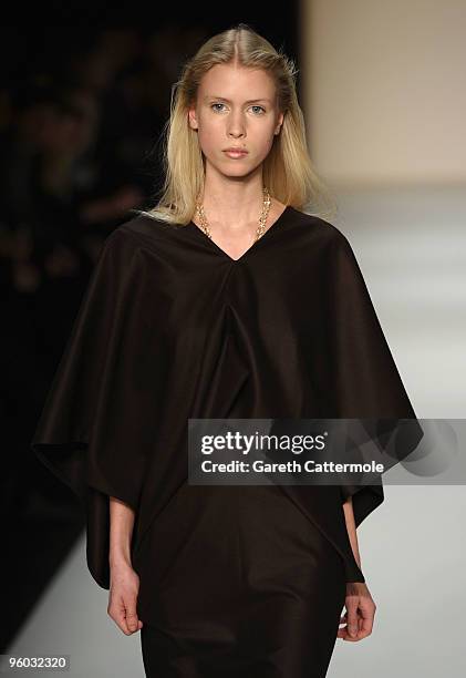 Model walks the runway at the Michael Sontag Fashion Show during the Mercedes-Benz Fashion Week Berlin Autumn/Winter 2010 at the Bebelplatz on...