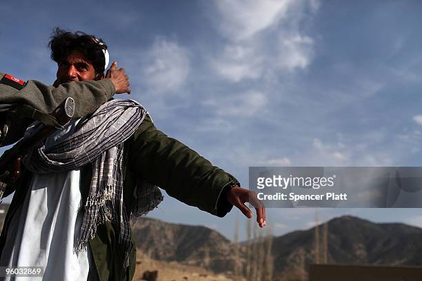 Man is searched for weapons by a member of the Afghan National Police January 23, 2010 in Zerak, Afghanistan. Zerak, located in Paktika Province,...