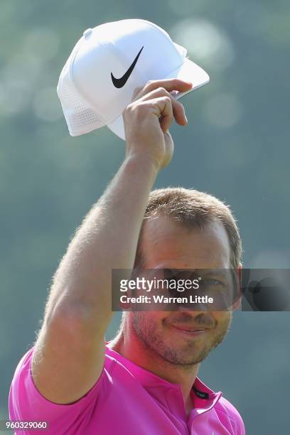 James Heath of England celebrates and takes off his cap to acknowledge the crowds after beating Nicolas Colsaerts of Belgium during their quater...