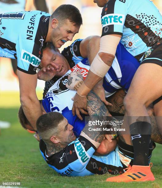 Matt Frawley of the Bulldogs is tackled during the round 11 NRL match between the Cronulla Sharks and the Canterbury Bulldogs at Southern Cross Group...