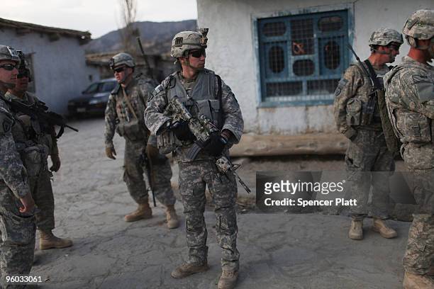 Soldiers with the US Army Able Company, 3-509 Infantry Battalion patrol the main street of Zerak January 23, 2010 next to their Combat Outpost in...