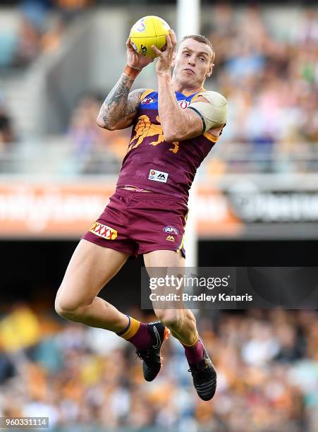 Mitch Robinson of the Lions takes a mark during the round nine AFL match between the Brisbane Lions and the Hawthorn Hawks at The Gabba on May 20,...