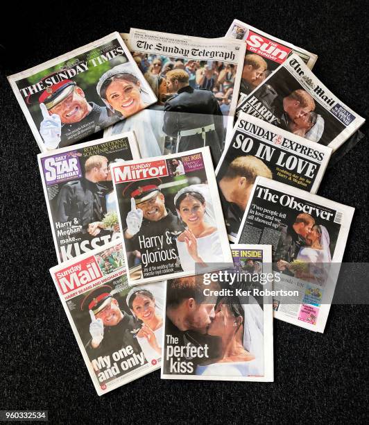 In this photo illustration front covers of United Kingdom Sunday newspapers are seen following the Royal Wedding yesterday in St George's Chapel at...