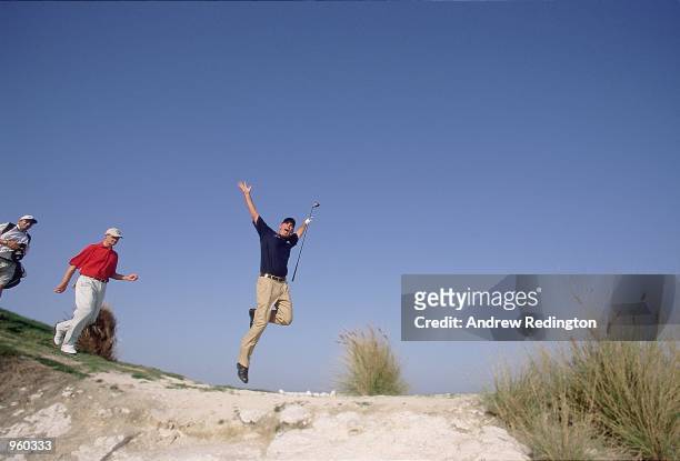 Thomas Bjorn of Denmark jumps into the bunker during the Qatar Masters 2001 held at the Doha Golf Club, in Doha, Qatar. \ Mandatory Credit: Andrew...