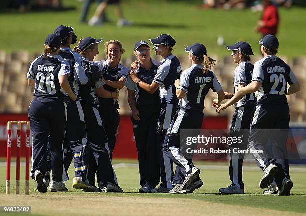 The Spirit celebrate a wicket during the women's Twenty20 Big Bash match between the Victorian Spirit and the NSW Breakers at Adeliade Oval on...