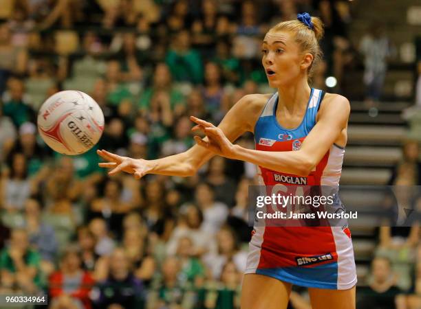 Helen Housby of the NSW Swifts passes the ball down the court to her team mate during the round four Super Netball match between the Fever and the...