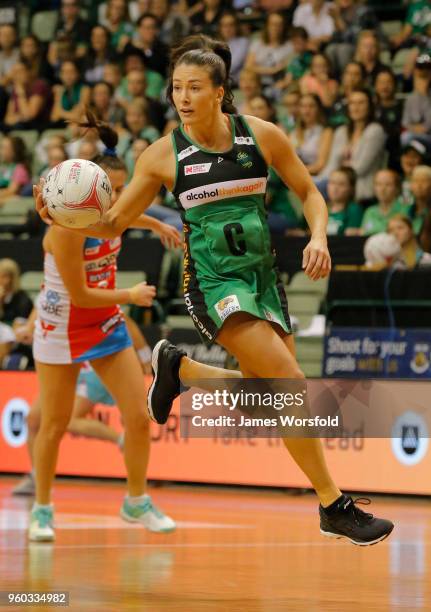 Verity Charles of the West Coast Fever glides through the air while taking possession of the ball during the round four Super Netball match between...