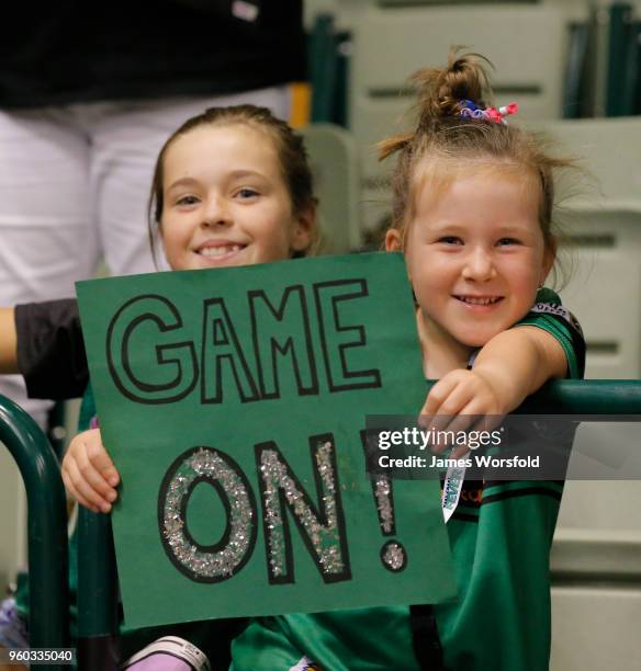 Girls in the crowd showing their support for the fever with their sign during the round four Super Netball match between the Fever and the Swifts at...