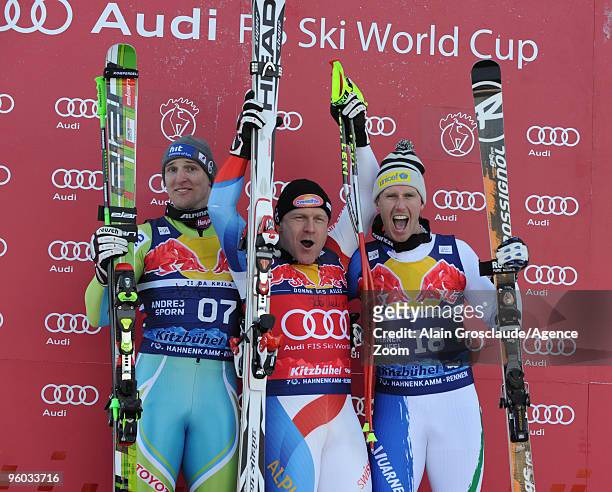 Andrej Sporn, 2nd, Didier Cuche, 1st, and Werner Heel, 3rd, pose on the podium during the podium of the Audi FIS Alpine Ski World Cup Men's Downhill...