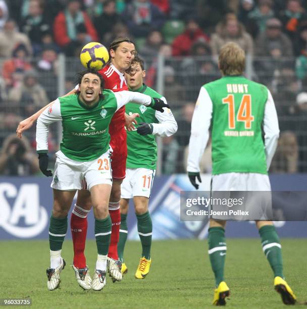 Hugo Almeida of Bremen and Daniel van Buyten of Muenchen compete for the ball during the Bundesliga match between Werder Bremen and FC Bayern...