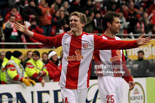 Andre Schuerrle of Mainz celebrates his team's first goal with team mate Andreas Ivanschitz during the Bundesliga match between FSV Mainz 05 and...