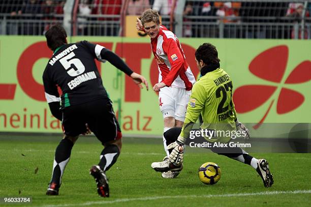 Andre Schuerrle of Mainz scores his team's first goal against Mario Eggimann and goalkeeper Florian Fromlowitz during the Bundesliga match between...