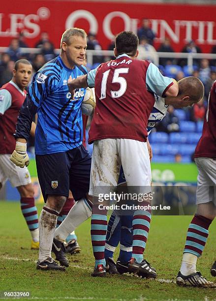 Goalkeeper Brian Jensen of Burnley has a word with Bryn Gunnarsson of Reading after he believes he tackled too hard during the FA Cup fourth round...