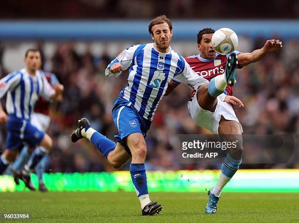 Aston Villa's Senegalese player Habib Beye vies with Brighton's English striker Glenn Murray during the FA Cup fourth round football match between...